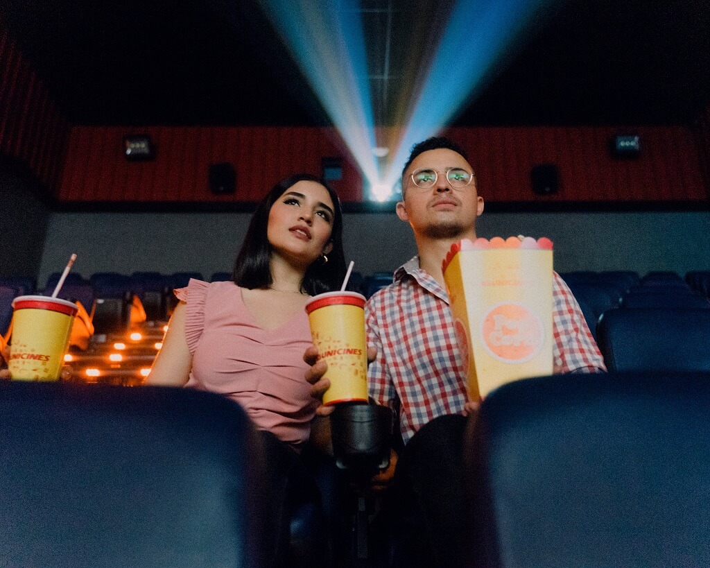 Two young people in a theater  watch a movie as you consider:  Who is the director of your life?