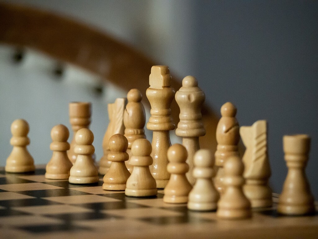 Chess pieces on a chess board to highlight moves toward being a  lovable man.