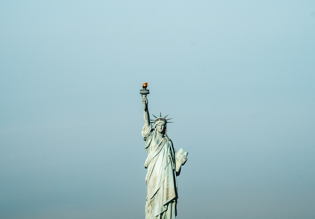 To save the marriage of Red and Blue, the Statue of Liberty, in the photo stands as a beacon for America to stay united.